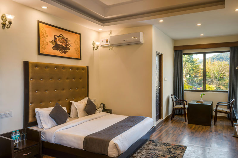 Elegant Room Interior and Comfortable Bedding at Corbett Jungle Treasure Resort