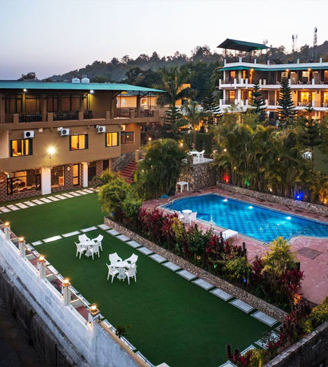 Luxury riverside resort in Jim Corbett offering serene nature views and premium stay.